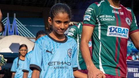 Celebrating Women's Month with young girls escorting players on Matchday