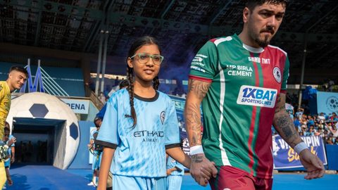 Celebrating Women's Month with young girls escorting players on Matchday
