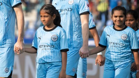 Celebrating Women's Month with young girls escorting players on Matchday