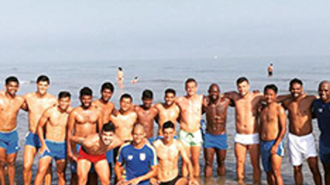 Players train at the beach
