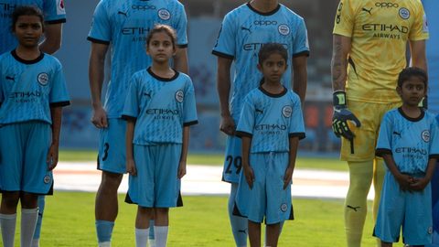 Celebrating Women's Month with young girls escorting players on Matchday